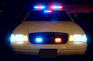 320px-Police_car_with_emergency_lights_on.jpg