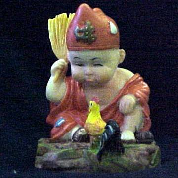 Buddha boy talking to chicken.jpg
