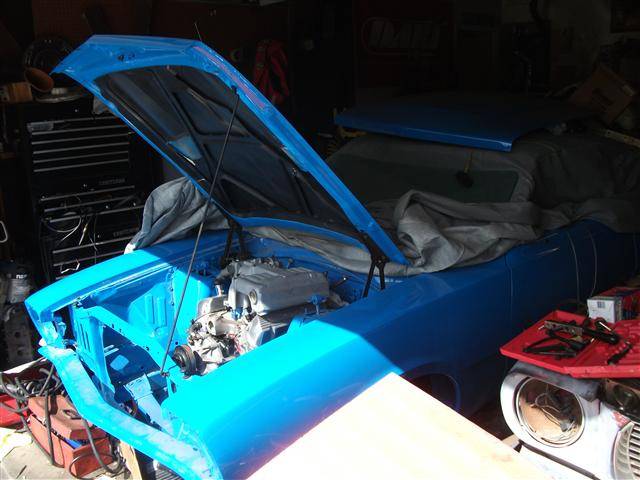 Mav%20in%20garage%20hood%20up.jpg